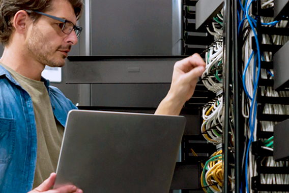 Smart building cabling laptop IT infastructure worker with glasses Smart building cabling laptop IT infastructure worker with glasses