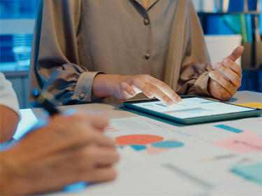 A woman working on a tablet